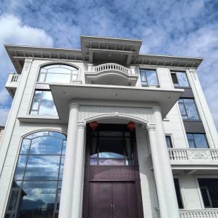 江门白麻别墅外墙干挂石材效果示例